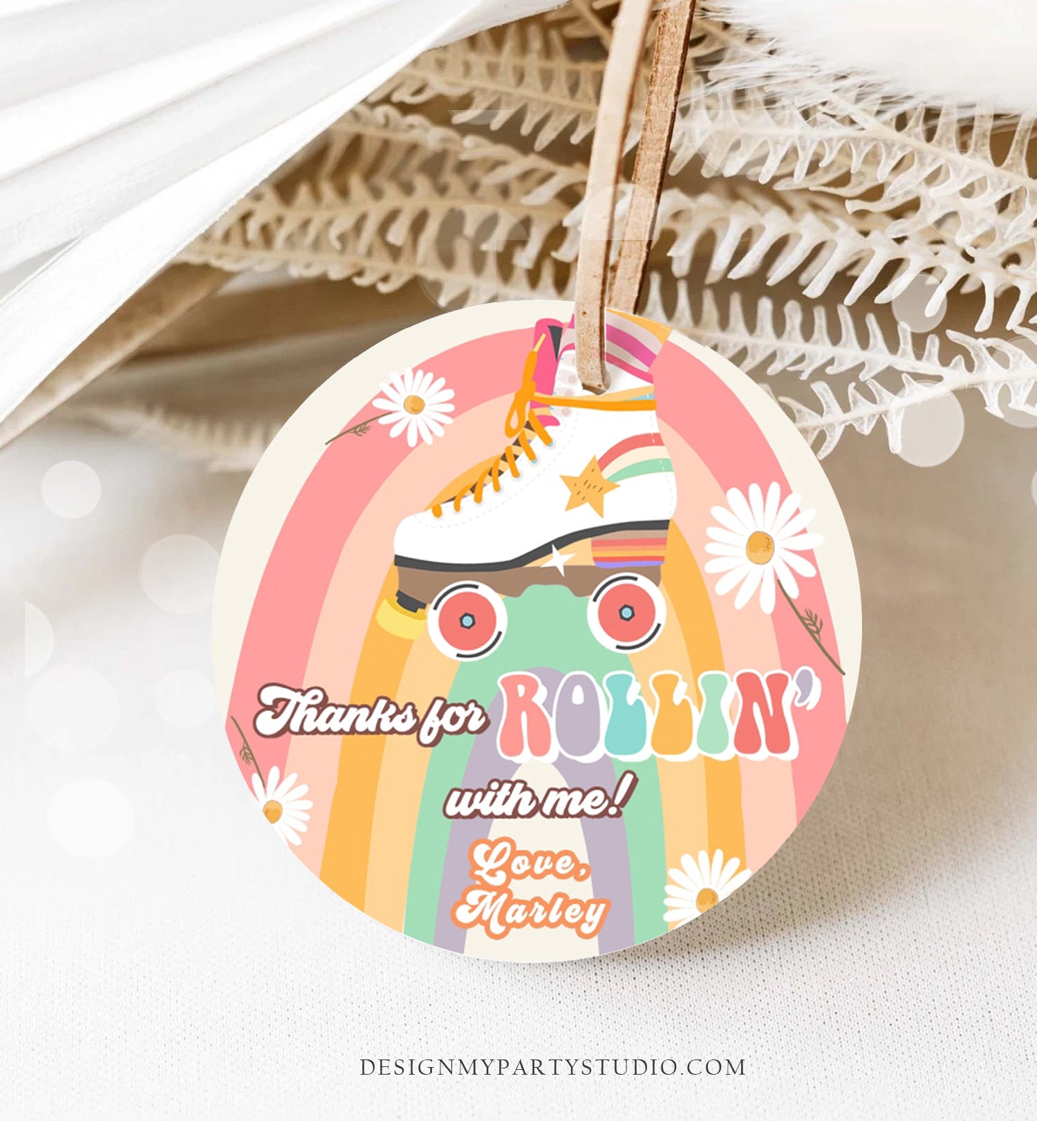 May include: A round, colorful thank you tag with a rainbow background and a white roller skate with rainbow wheels. The tag has the text 'Thanks for Rollin' with me! Love, Marley'.