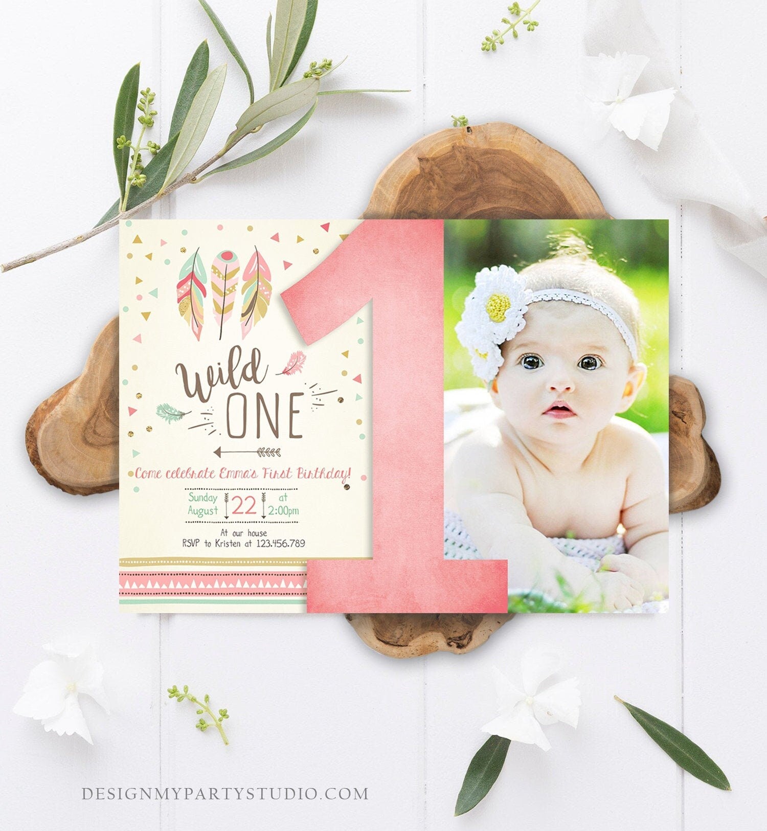 May include: A pink and green first birthday invitation with a photo of a baby girl. The invitation has a pink number one, feathers, and the text 'Wild One.' The text also includes the date, time, and RSVP information.