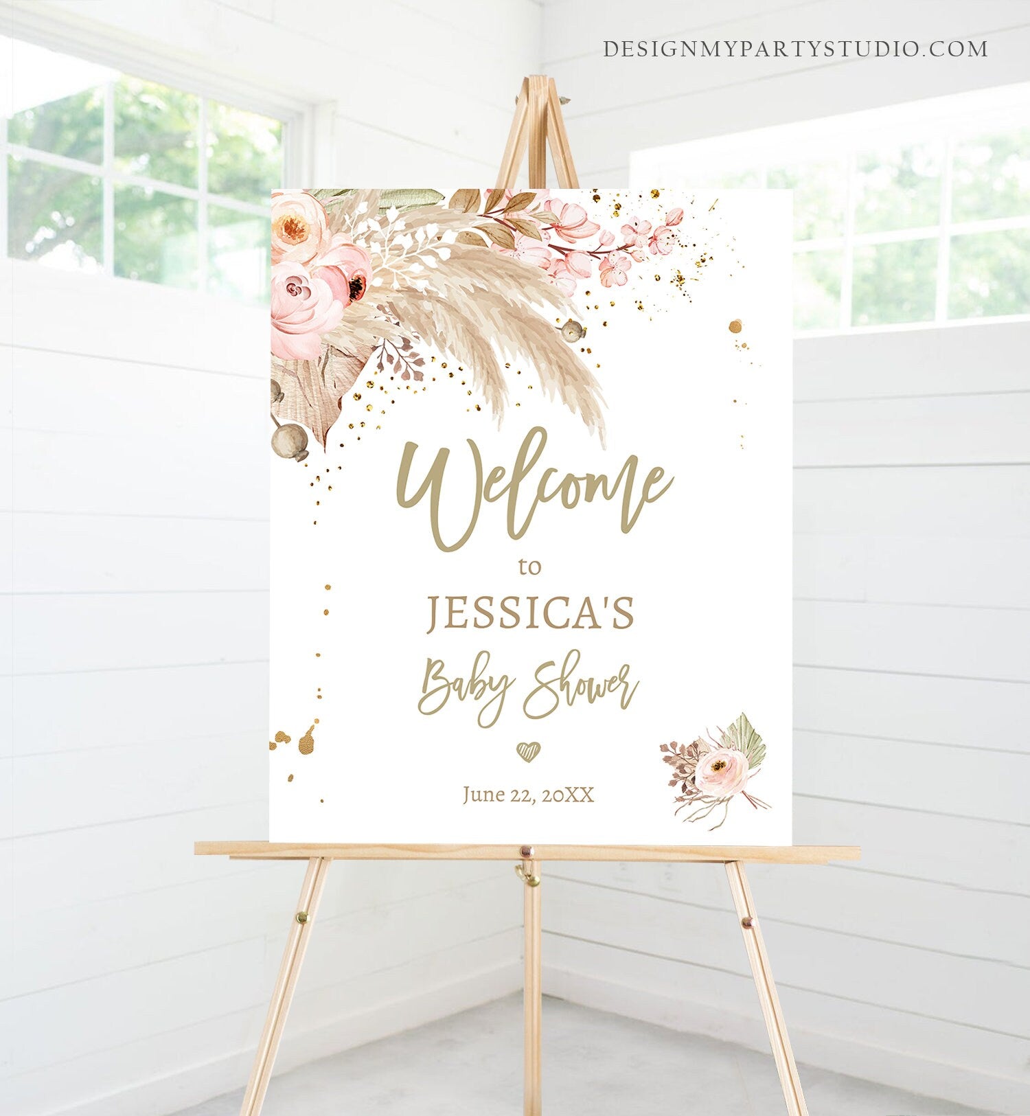 May include: Welcome to Jessica's Baby Shower sign with a floral design in shades of pink, brown, and gold. The sign has a white background and the text is in gold. The date of the shower is June 22, 20XX.
