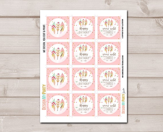 May include: Three pink and gold cupcake toppers with feathers and text. The toppers read &#39;young and wild three&#39;, &#39;happy birthday&#39;, and &#39;happy birthday&#39;. The toppers are on top of cupcakes with green, yellow, and pink frosting.