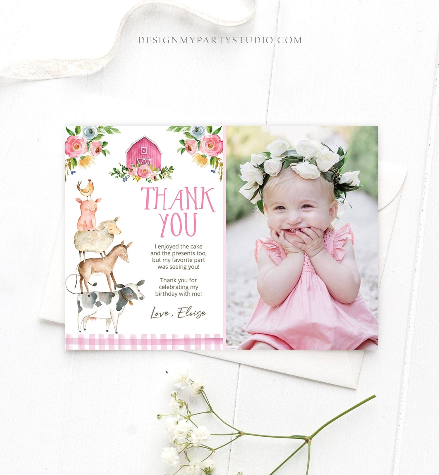 May include: A pink and white thank you card with a pink barn and floral design. The card has a picture of a baby girl in a pink dress and a white flower crown. The text on the card reads &#39;Thank You&#39;, &#39;I enjoyed the cake and the presents too, but my favorite part was seeing you!&#39;, &#39;Thank you for celebrating my birthday with me!&#39;, and &#39;Love, Eloise&#39;.