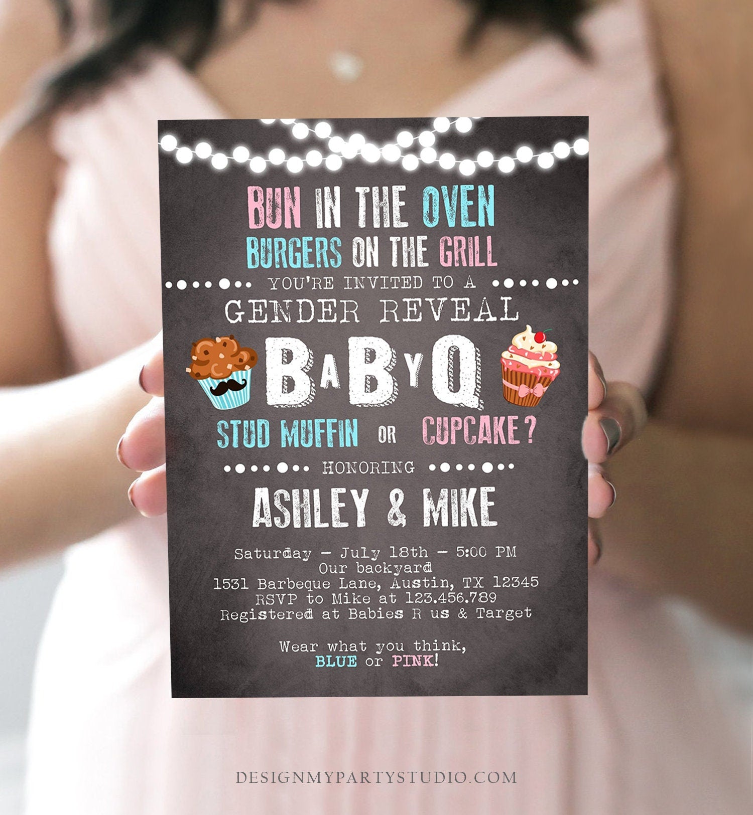 May include: A chalkboard-style gender reveal party invitation with a blue and pink cupcake theme. The text reads: &#39;Bun in the Oven Burgers on the Grill... You&#39;re invited to a Gender Reveal BabyQ Stud Muffin or Cupcake? ... Honoring Ashley & Mike Saturday - July 18th - 5:00 PM Our backyard 1531 Barbeque Lane, Austin, TX 12345 RSVP to Mike at 123.456.789 Registered at Babies R Us & Target Wear what you think, Blue or Pink!&#39;.