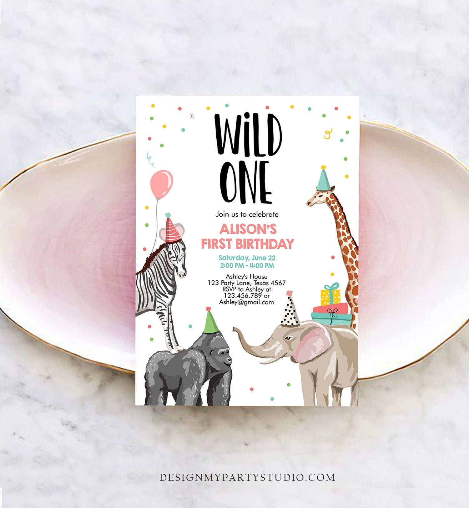 May include: A cute and colorful &#39;Wild One&#39; first birthday invitation features a whimsical design with animals like a zebra, gorilla, elephant, and giraffe. The invitation is predominantly white with pastel accents and confetti.  It includes the birthday girl&#39;s name, Alison, date, time, location, and RSVP information. The text &#39;Wild One&#39; is prominently displayed at the top.