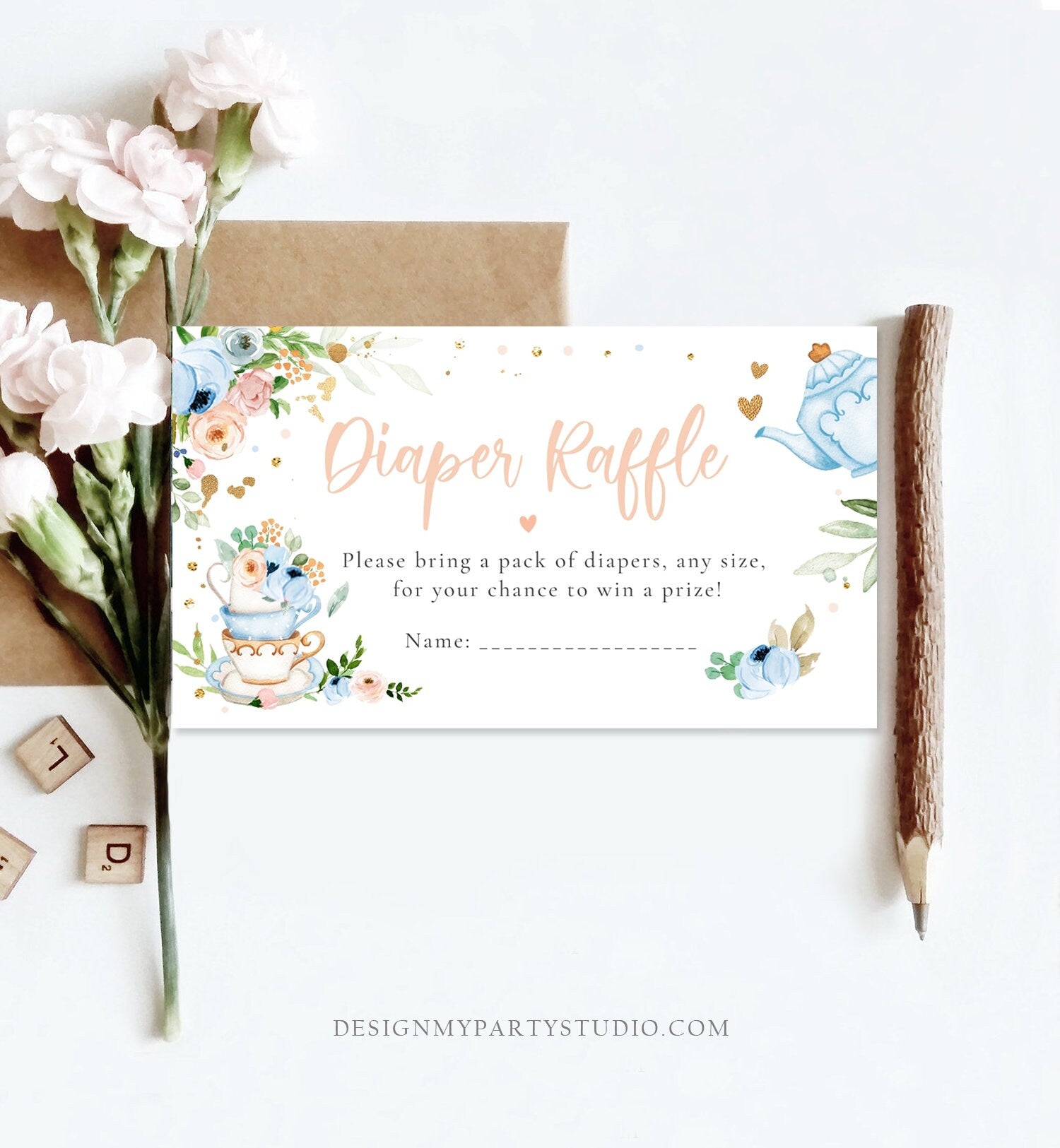May include: A white card with blue and pink floral designs and gold accents. The text on the card reads &#39;Diaper Raffle&#39; in pink text with a heart symbol. The text below reads &#39;Please bring a pack of diapers, any size, for your chance to win a prize!&#39; and &#39;Name:&#39; with a blank line for the name.