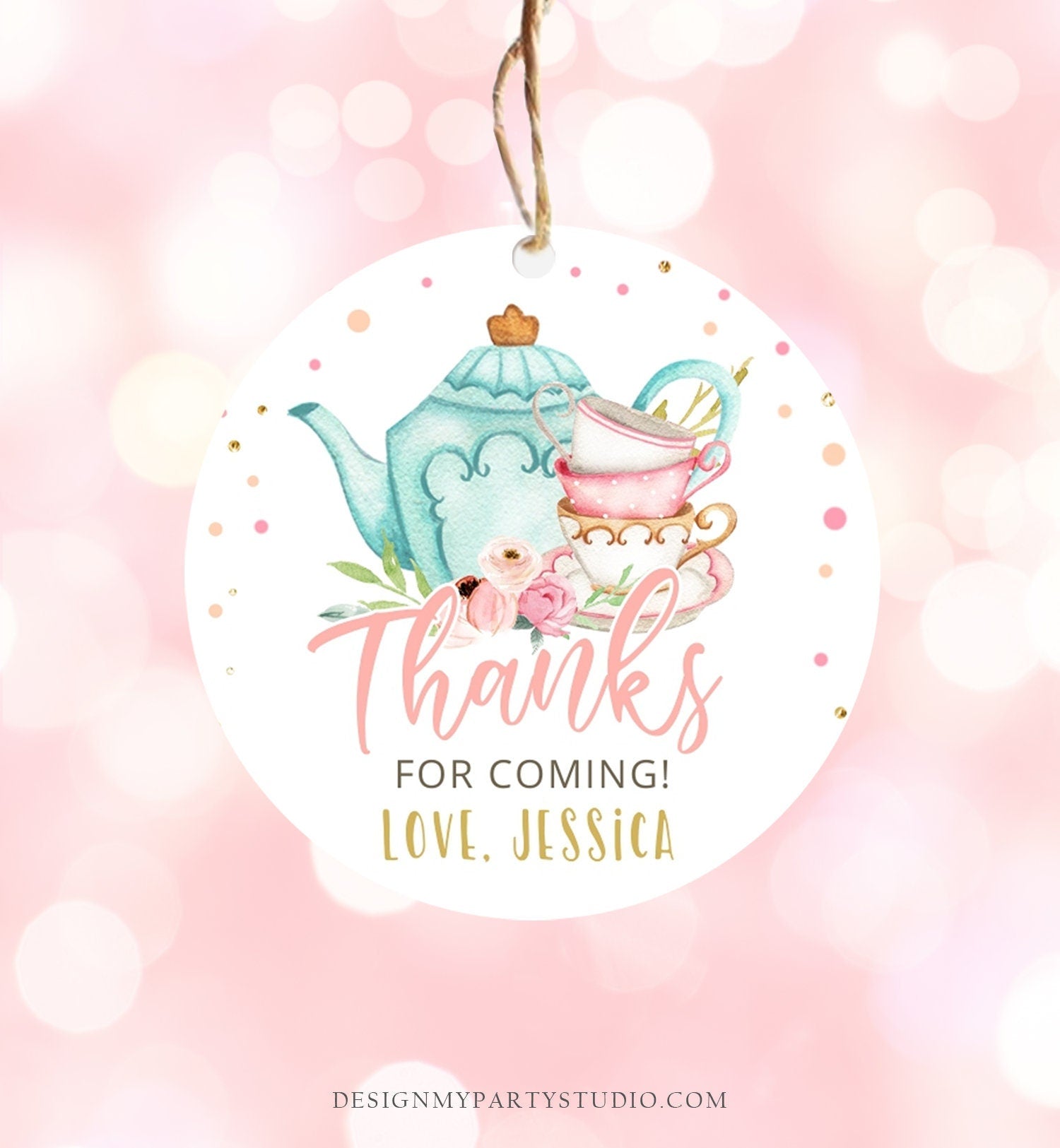 May include: Round white thank you tag with a blue teapot, pink and white teacups, and pink flowers. The tag has gold glitter and the text &#39;Thanks for coming! Love, Jessica&#39;.