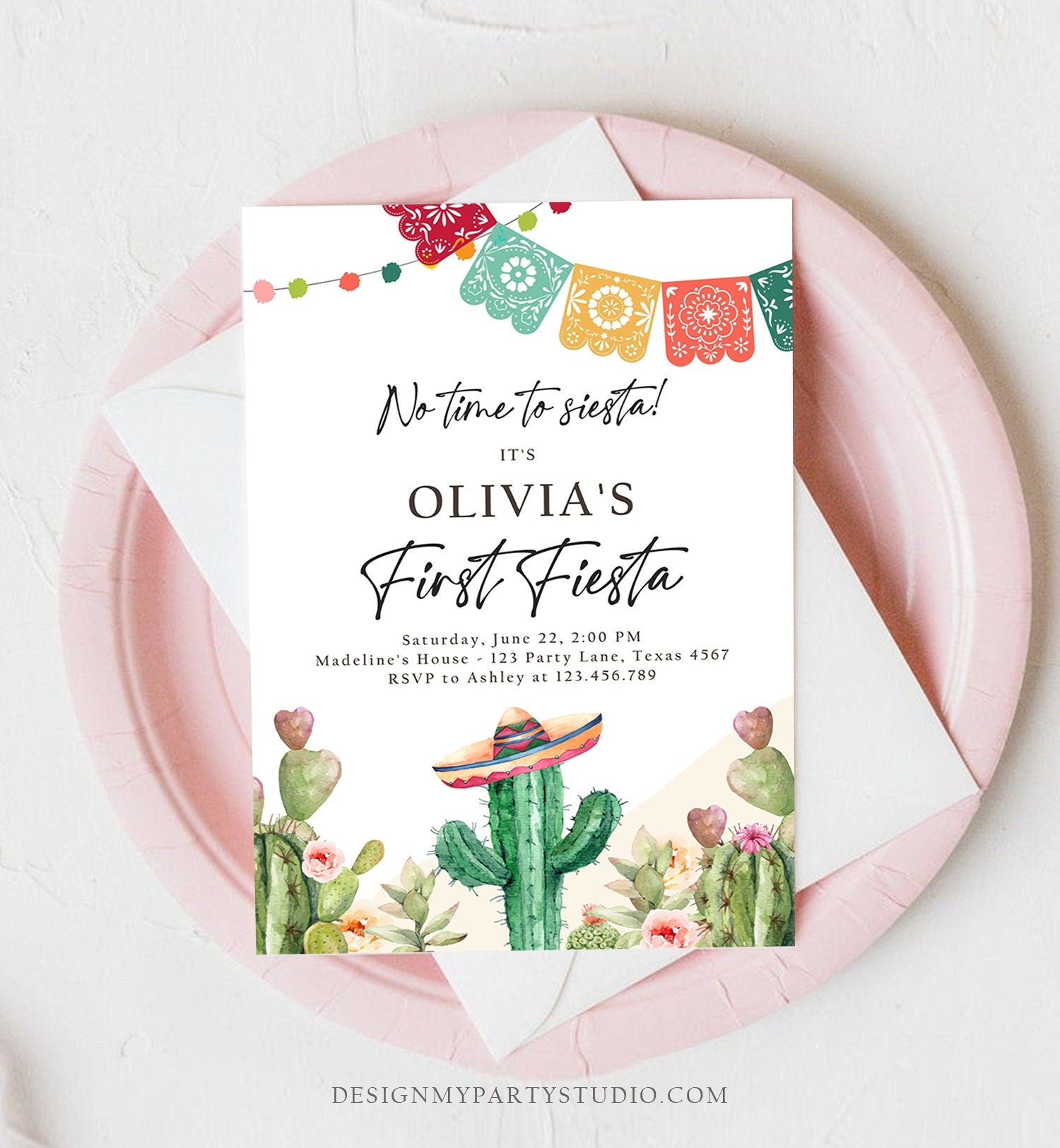 May include: A first birthday party invitation with a cactus theme. The invitation is white with a green cactus wearing a sombrero. The text reads &#39;No time to siesta! It&#39;s Olivia&#39;s First Fiesta. Saturday, June 22, 2:00 PM. Madeline&#39;s House - 123 Party Lane, Texas 4567. RSVP to Ashley at 123.456.789. DESIGNMYPARTYSTUDIO.COM&#39;