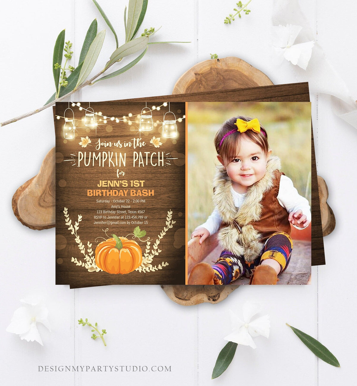 May include: A rustic brown wood background with a pumpkin patch theme birthday invitation. The invitation has a photo of a baby girl wearing a brown vest and a yellow bow. The text on the invitation reads &amp;#39;Join us in the Pumpkin Patch for Jenn&amp;#39;s 1st Birthday Bash&amp;#39;.
