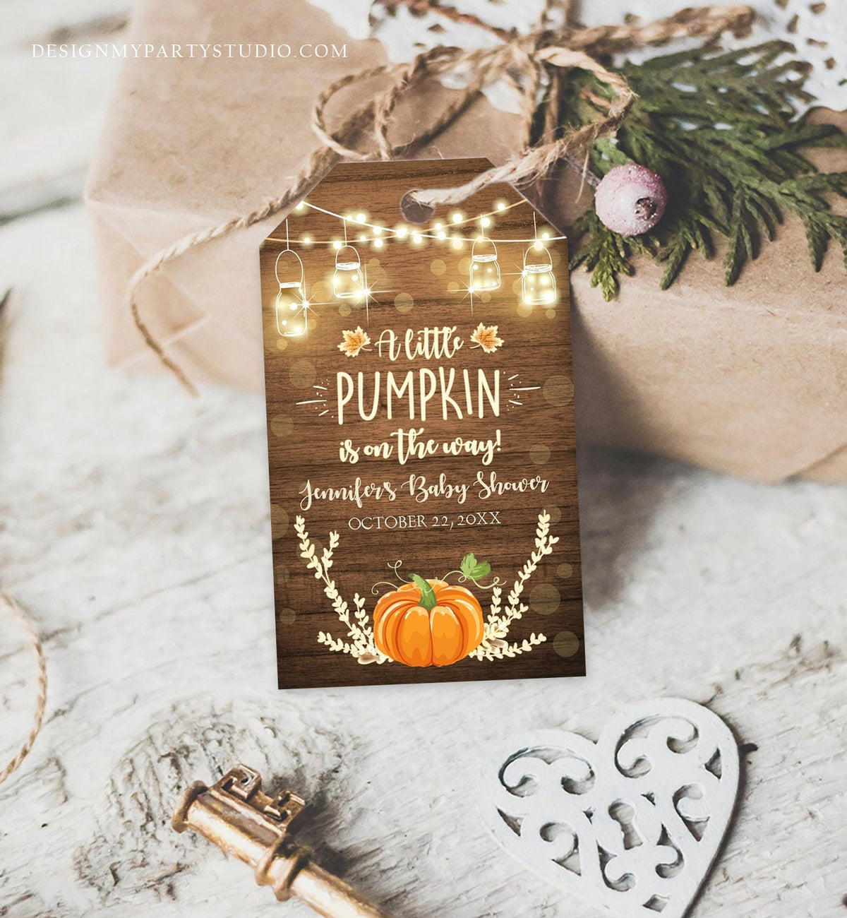 May include: A rustic brown wood baby shower favor tag with a pumpkin, lights, and leaves. The text on the tag reads &amp;#39;A little pumpkin is on the way! Jennifer&amp;#39;s Baby Shower October 22, 20XX&amp;#39;