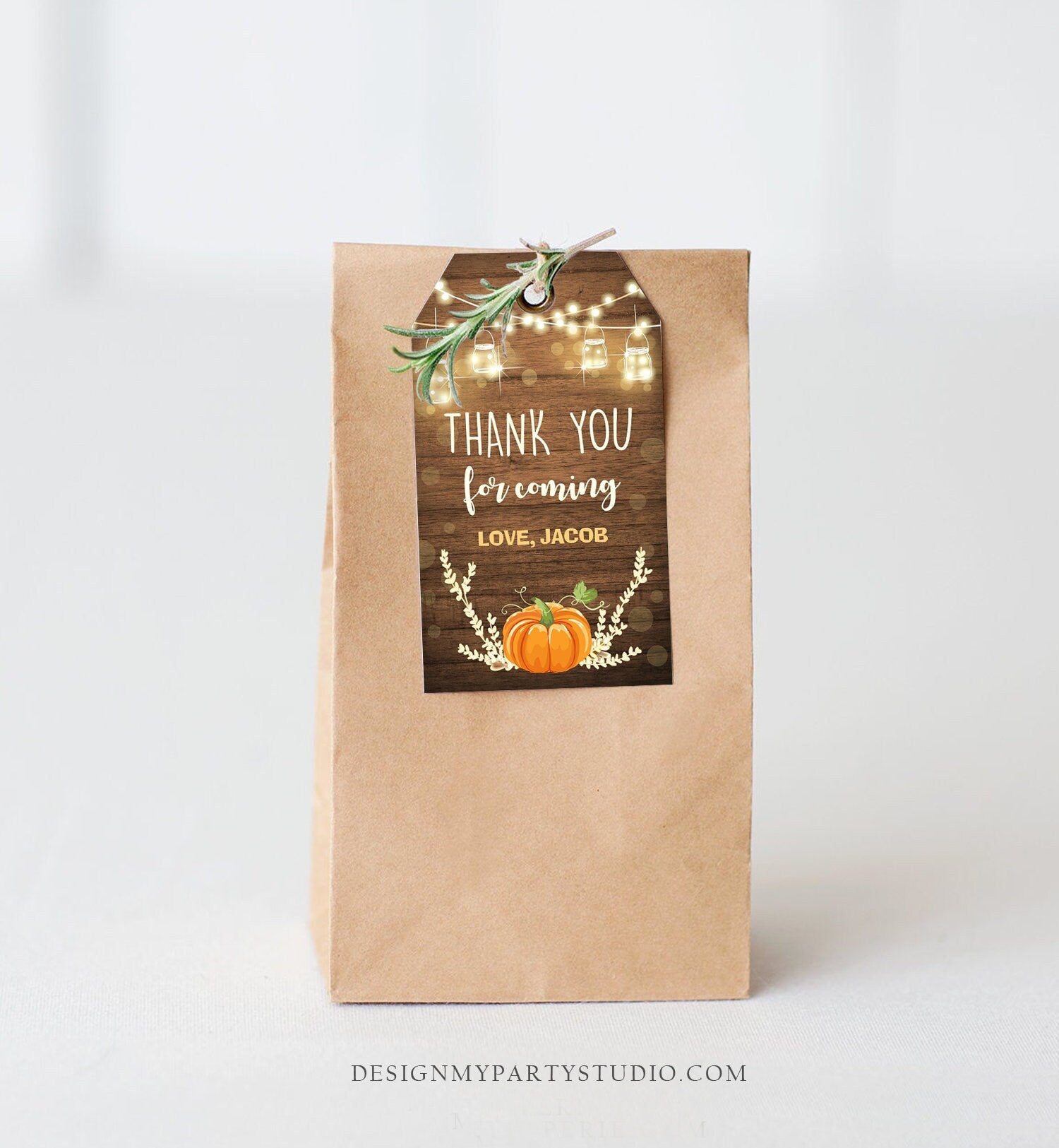 May include: A brown paper bag with a thank you tag attached. The tag is a rustic wood design with a pumpkin, lights, and the text 'Thank you for coming Love, Jacob'.
