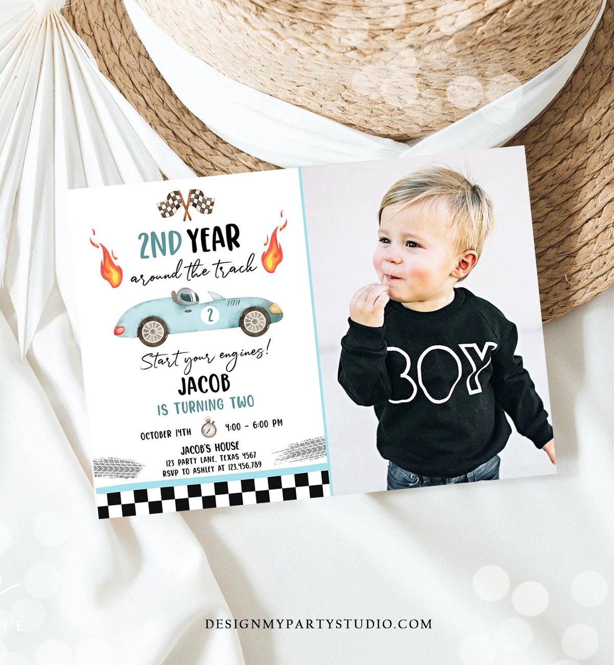 May include: A birthday invitation with a blue and white checkered background. The invitation features a cartoon illustration of a blue race car with the number 2 on it. The text on the invitation reads &amp;#39;2nd Year Around the Track&amp;#39;, &amp;#39;Start Your Engines!&amp;#39;, &amp;#39;Jacob is Turning Two&amp;#39;, &amp;#39;October 17th 4:00 - 6:00 PM&amp;#39;, &amp;#39;Jacob&amp;#39;s House 123 Party Lane, Texas 7867&amp;#39;, &amp;#39;RSVP to Ashley at 123.456.789&amp;#39;. A photo of a child wearing a black shirt with the word &amp;#39;B