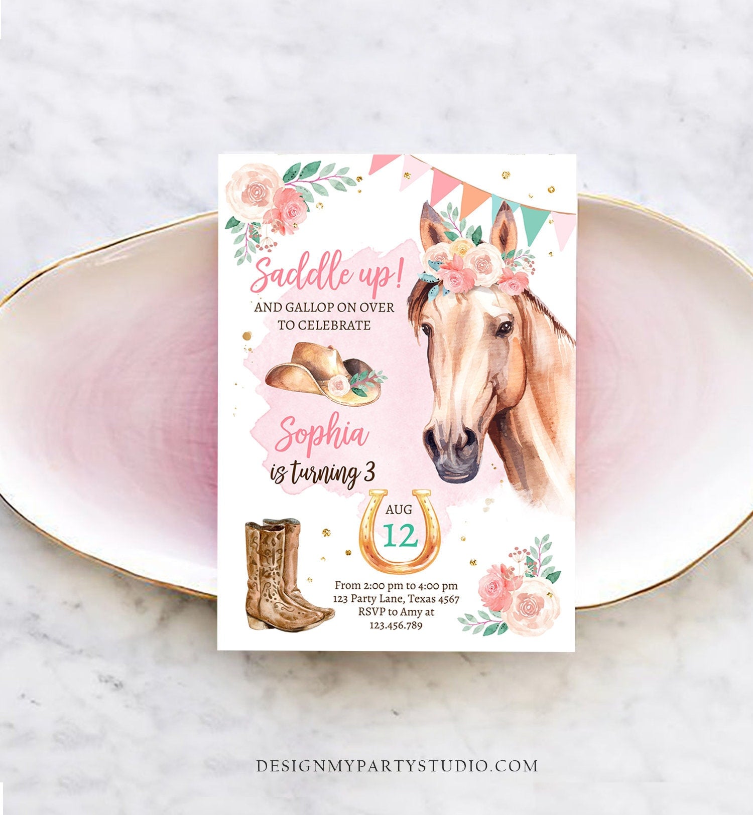 May include: A pink and white birthday invitation with a watercolor illustration of a brown horse with a floral crown. The text on the invitation reads &#39;Saddle up! And gallop on over to celebrate Sophia is turning 3. Aug 12. From 2:00 pm to 4:00 pm 123 Party Lane, Texas 4567 RSVP to Amy at 123.456.789 DesignMyPartyStudio.com&#39;