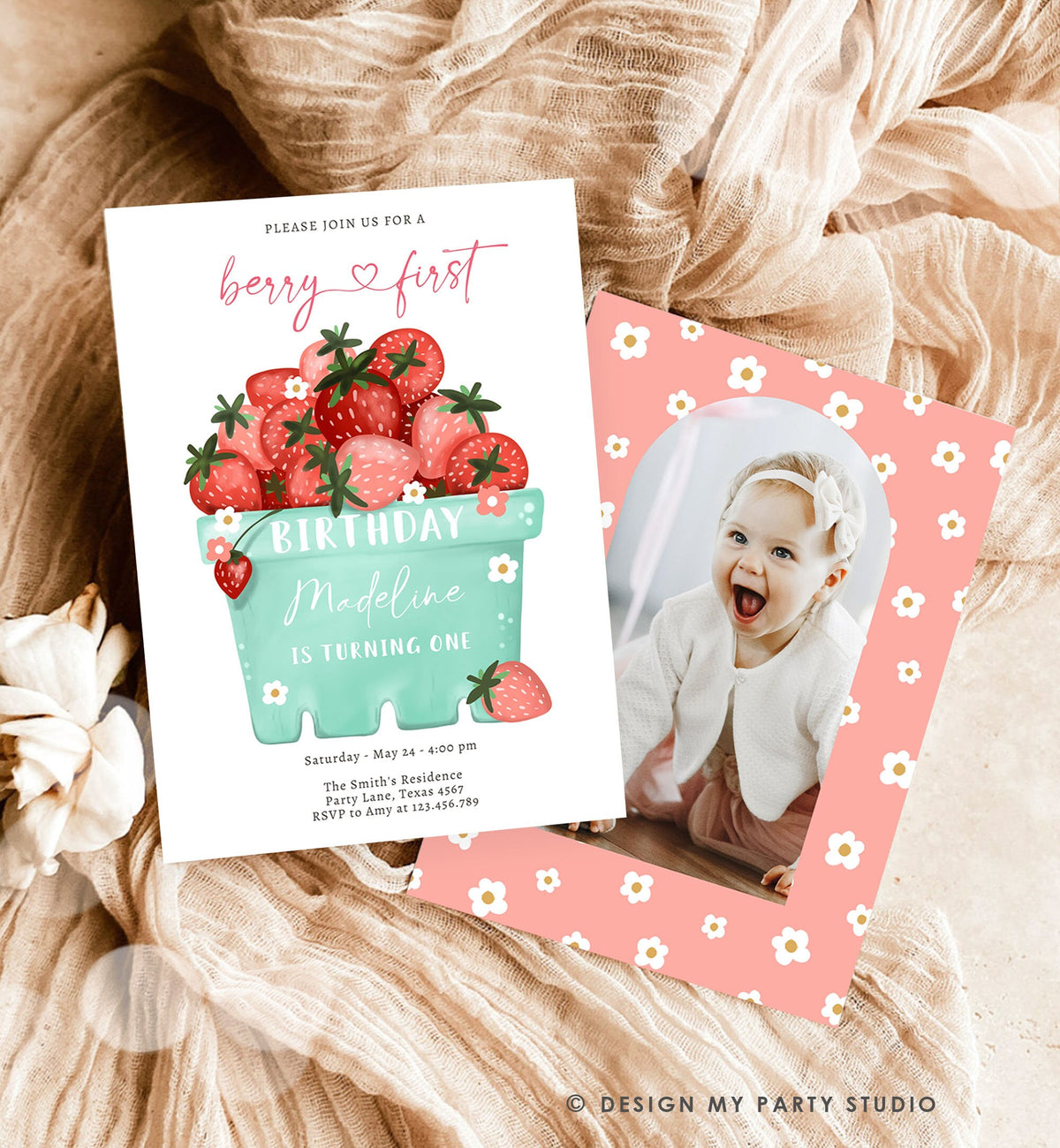 May include: A pink and white birthday invitation with a photo frame. The invitation has a green and white illustration of a basket of strawberries. The text on the invitation reads &amp;#39;Please join us for a berry first birthday Madeline is turning one. Saturday May 24-4:00 pm The Smith&amp;#39;s Residence Party Lane, Texas 4567 RSVP to Amy at 123.456.789&amp;#39;.