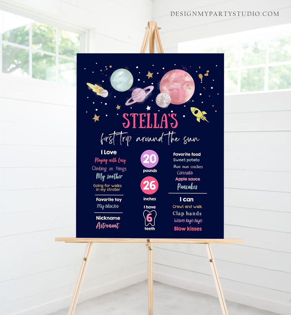 May include: A blue and pink printable birthday sign with the text &amp;#39;STELLA&amp;#39;S first trip around the sun&amp;#39;. The sign includes a list of Stella&amp;#39;s stats, including her weight, height, and favorite things. The sign is decorated with stars, planets, and a rocket ship.