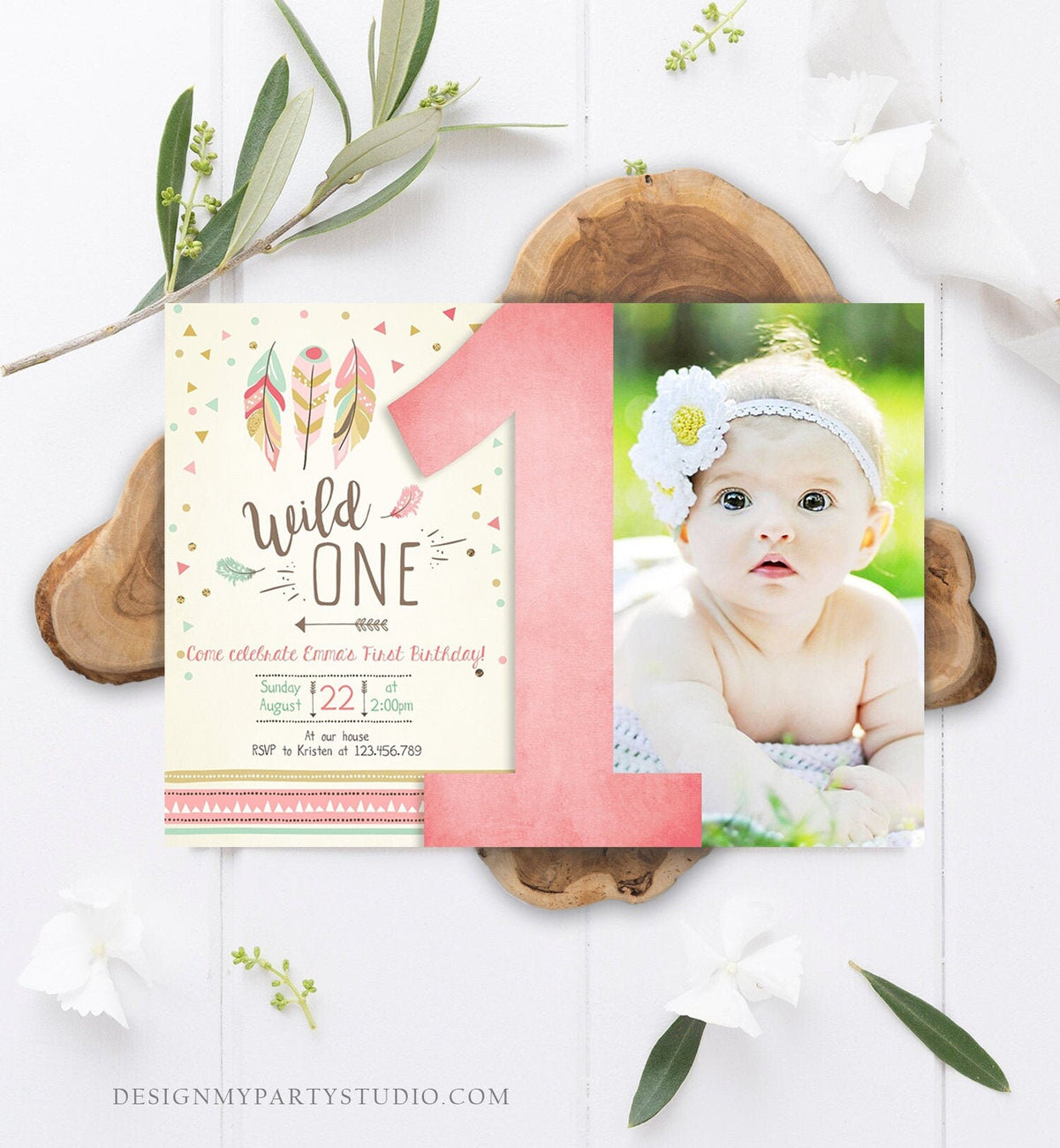 May include: A pink and green first birthday invitation with a photo of a baby girl. The invitation has a pink number one, feathers, and the text &amp;#39;Wild One.&amp;#39; The text also includes the date, time, and RSVP information.
