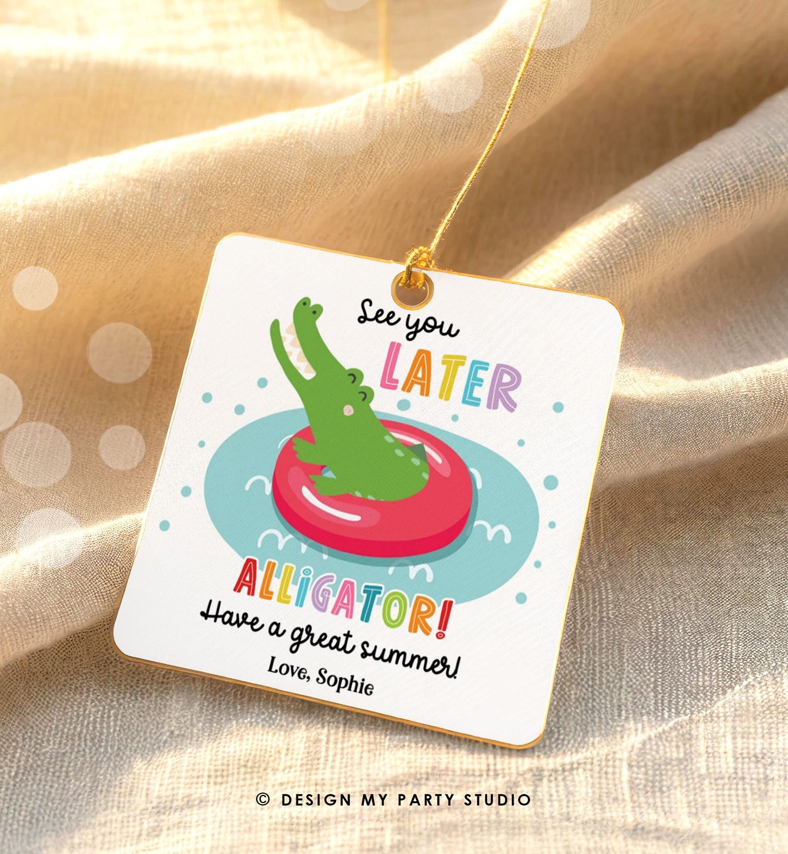 May include: A white card with a green alligator wearing a red inner tube and floating in blue water. The card has the text 'See you LATER ALLIGATOR! Have a great summer! Love, Sophie' in colorful letters.