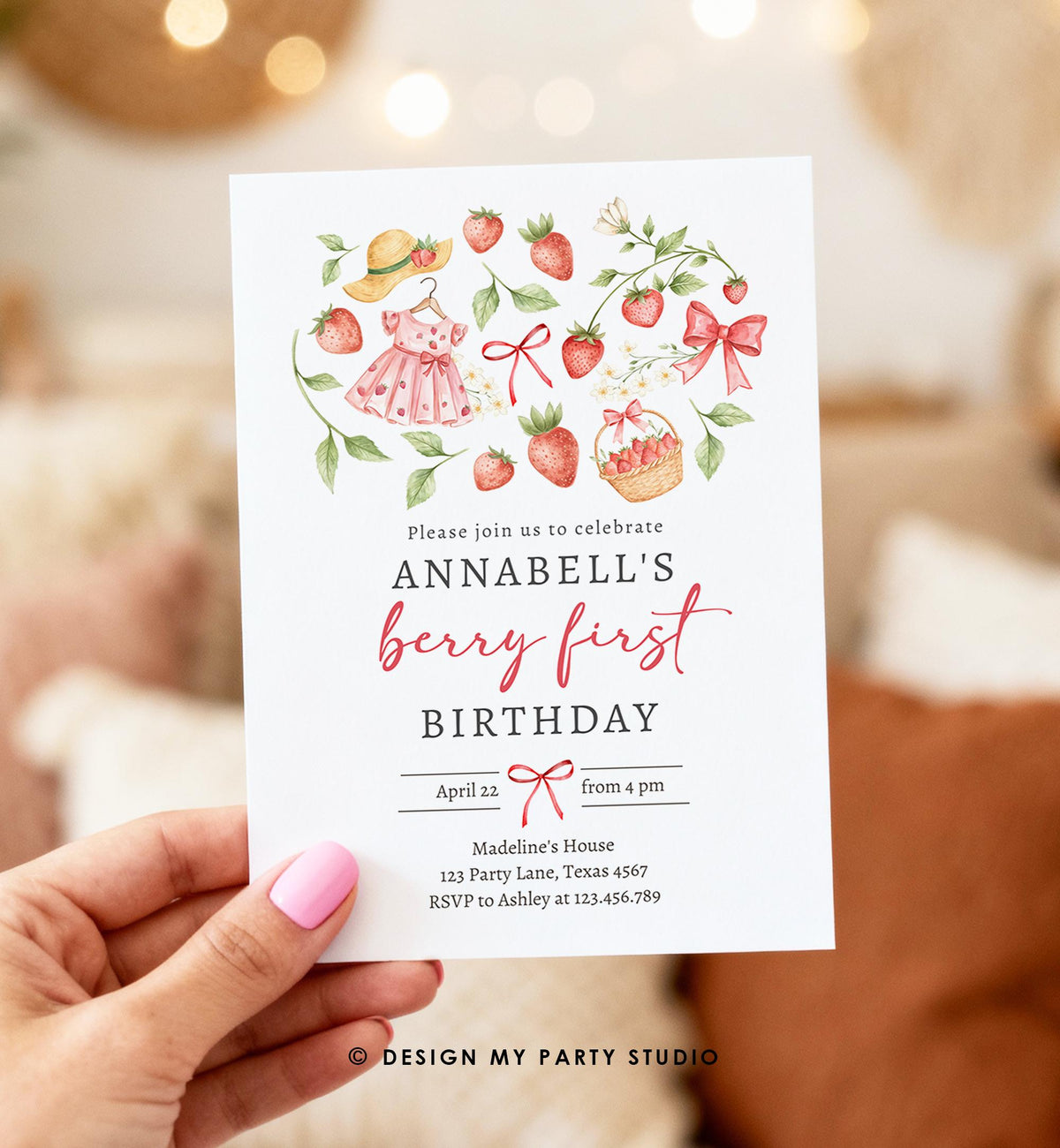 May include: A white invitation card with a watercolor design featuring strawberries, a dress, and a sun hat. The text reads &amp;quot;Please join us to celebrate Annabell&amp;#39;s berry first birthday.&amp;quot; Additional text includes the date, time, and RSVP information.
