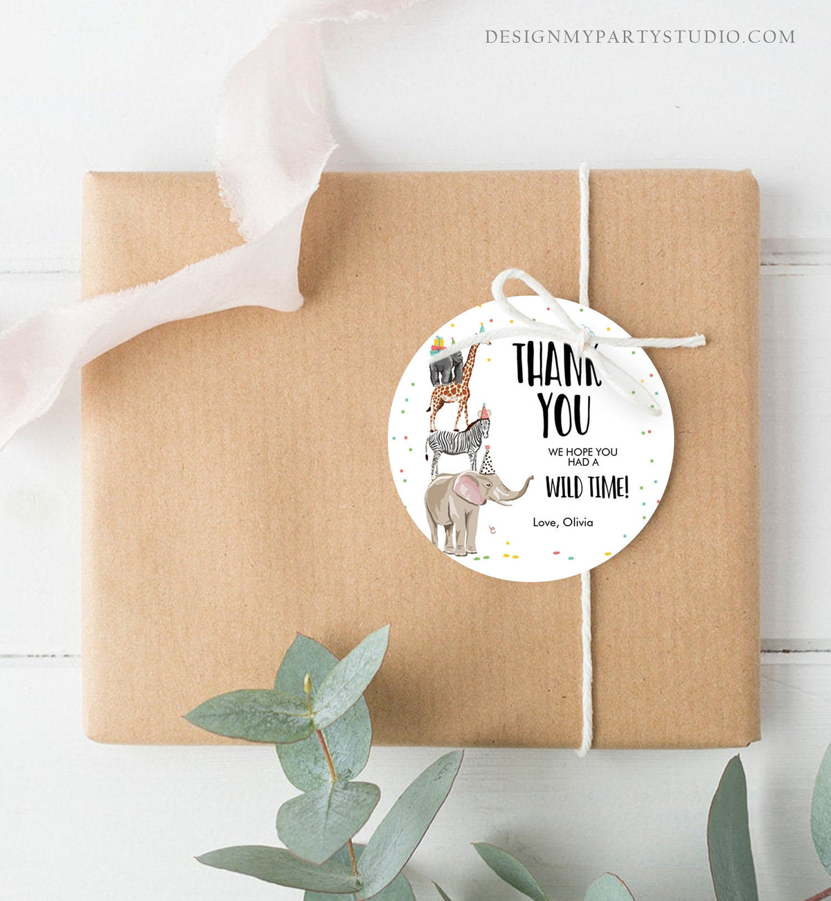 May include: Round white thank you tag with a stack of safari animals wearing party hats. The tag says &amp;quot;Thank You&amp;quot; and &amp;quot;We hope you had a wild time!&amp;quot; with the name &amp;quot;Olivia&amp;quot; at the bottom.