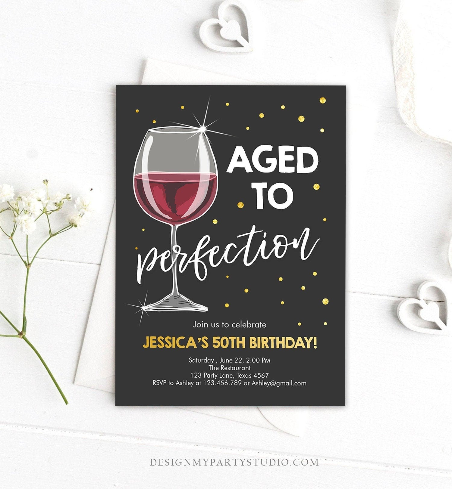 May include: Black and gold 50th birthday party invitation with a glass of red wine. The text reads "Aged to Perfection" and includes details for the party, including the date, time, location, and RSVP information.